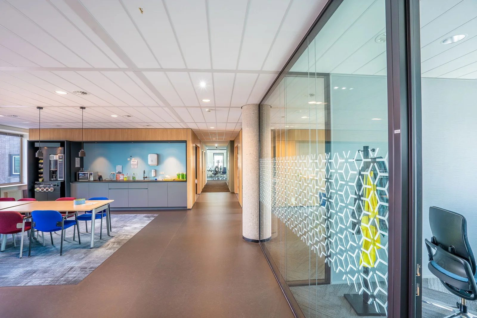 An office glass wall with a patterned decorative film