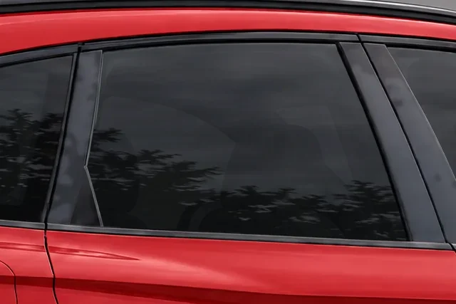 The window of a red Audi SQ5 with 15% Union window tint
