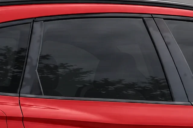 The window of a red Audi SQ5 with 20% Union window tint