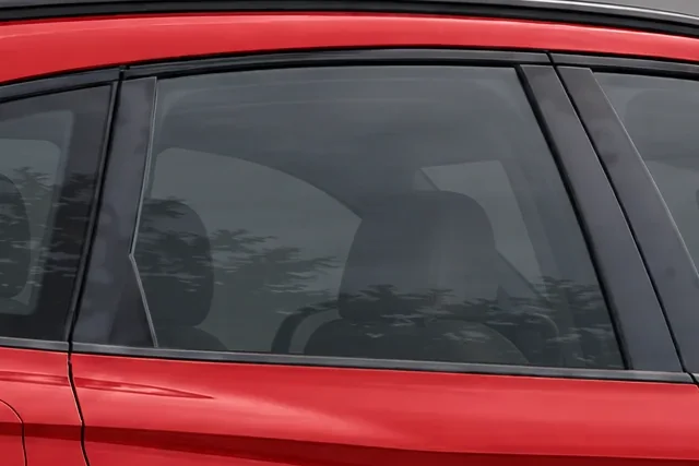 The window of a red Audi SQ5 with 35% Union window tint