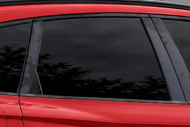 The window of a red Audi SQ5 with 5% Union window tint