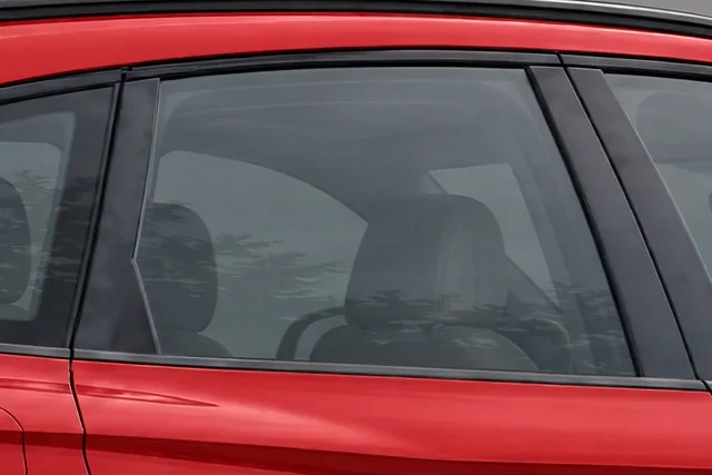 The window of a red Audi SQ5 with 50% Union window tint
