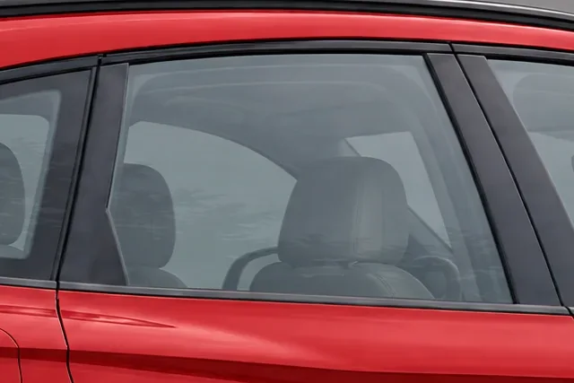 The window of a red Audi SQ5 with 70% Union window tint